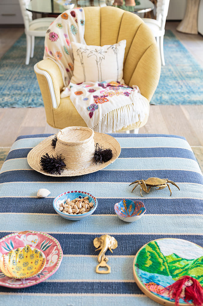 Coffee table flatlay striped ottoman yellow shell chair embroidered throw brass crab straw hat — Bronwyn Poole Interiors Coffee table flatlay striped ottoman yellow shell chair embroidered throw brass crab straw hat — Bronwyn Poole Interiors