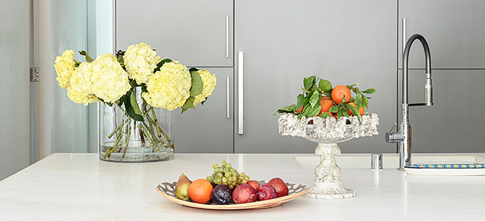 Kitchen counter hydrangea bouquet fruit bowl stone pedestal grey cabinets — Bronwyn Poole Interiors Kitchen counter hydrangea bouquet fruit bowl stone pedestal grey cabinets — Bronwyn Poole Interiors