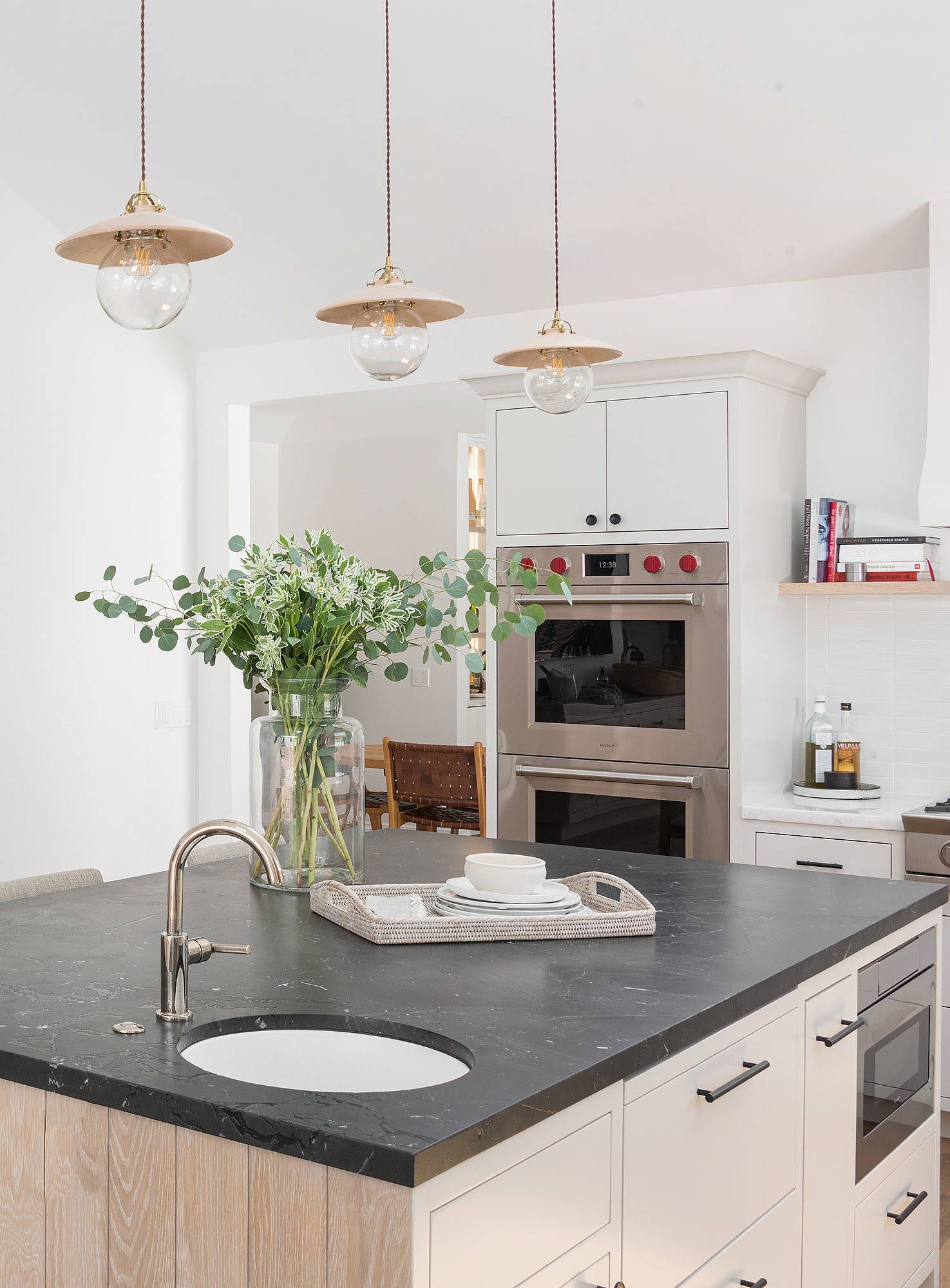 Kitchen island soapstone counter glass pendants eucalyptus vase double wolf oven — Bronwyn Poole Interiors Kitchen island soapstone counter glass pendants eucalyptus vase double wolf oven — Bronwyn Poole Interiors