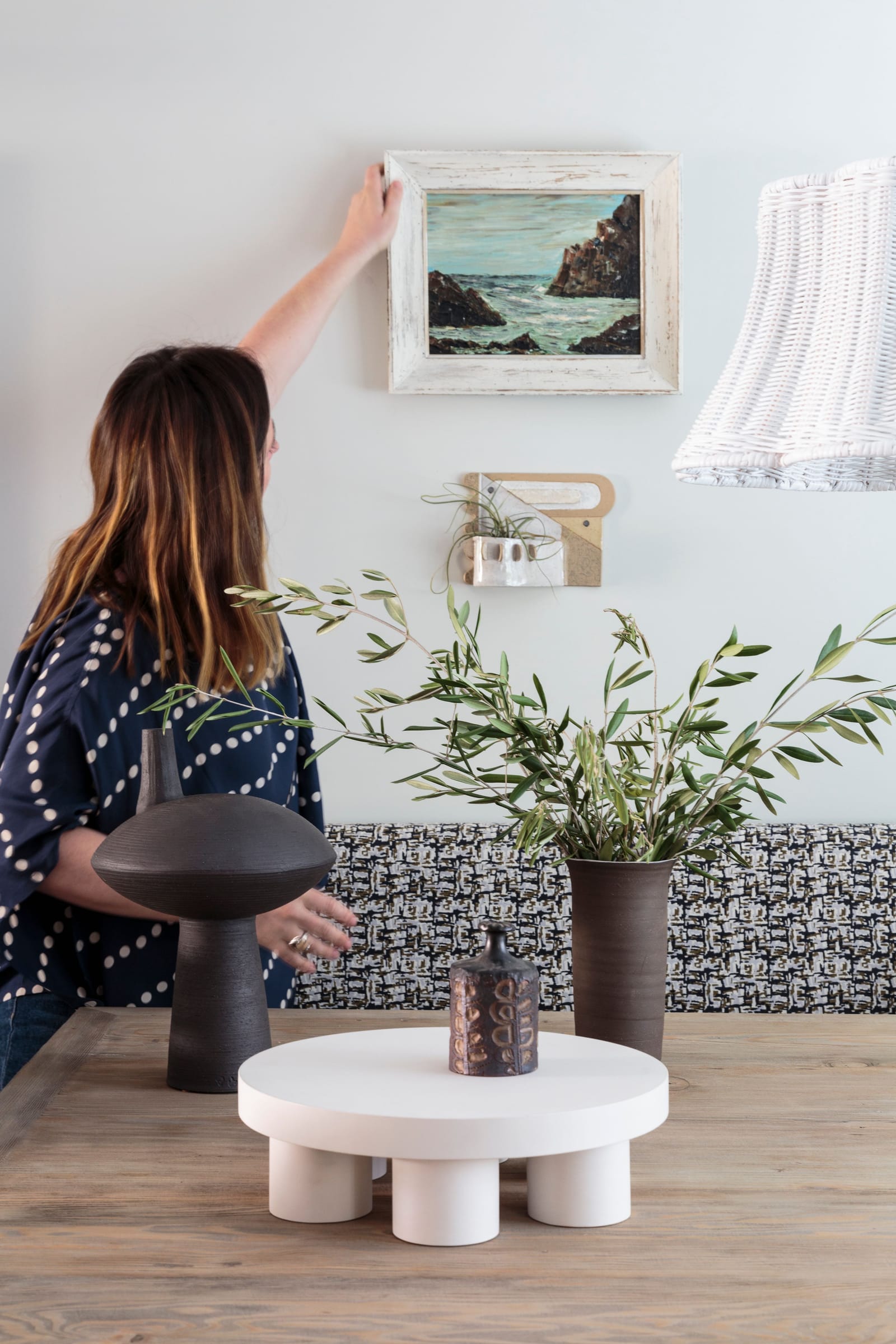 Bronwyn Poole styling artwork in a curated Los Angeles interior