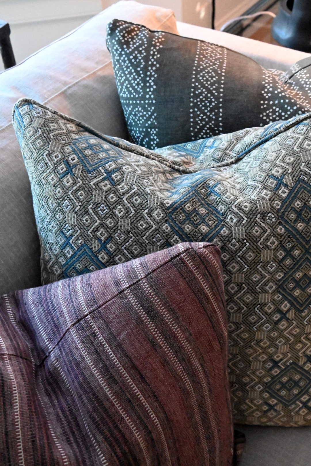 Bay window pillow detail blue mudcloth teal diamond weave aubergine striped pillow grey linen sofa — Bronwyn Poole Interiors Bay window pillow detail blue mudcloth teal diamond weave aubergine striped pillow grey linen sofa — Bronwyn Poole Interiors