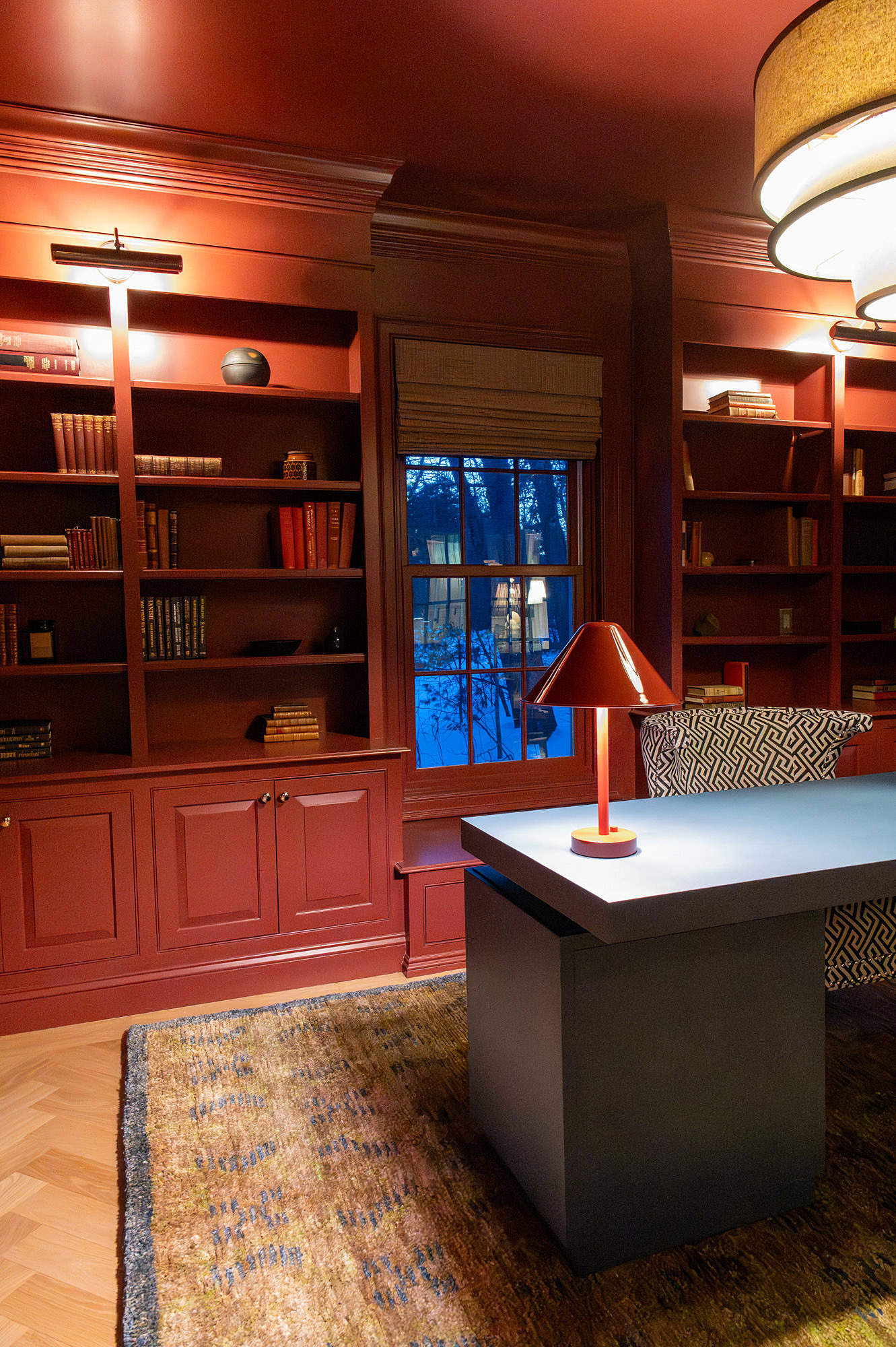Den crimson built ins window seat blue desk greek key armchair orange cordless lamp tiered drum pendant jute rug — Bronwyn Poole Interiors