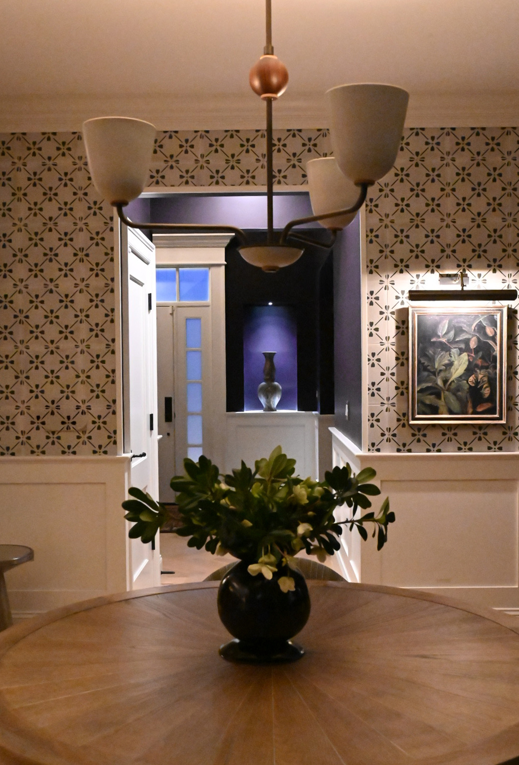 Dining area floral cement tile chandelier detail view to foyer niche marbled vase botanical art — Bronwyn Poole Interiors