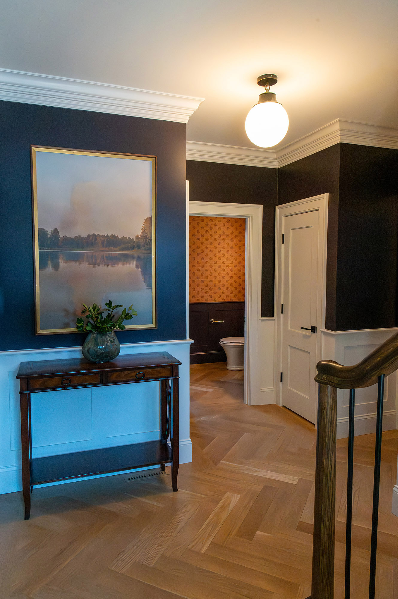 Hallway navy walls lake landscape art mahogany console globe pendant powder room view herringbone floor — Bronwyn Poole Interiors Hallway navy walls lake landscape art mahogany console globe pendant powder room view herringbone floor — Bronwyn Poole Interiors