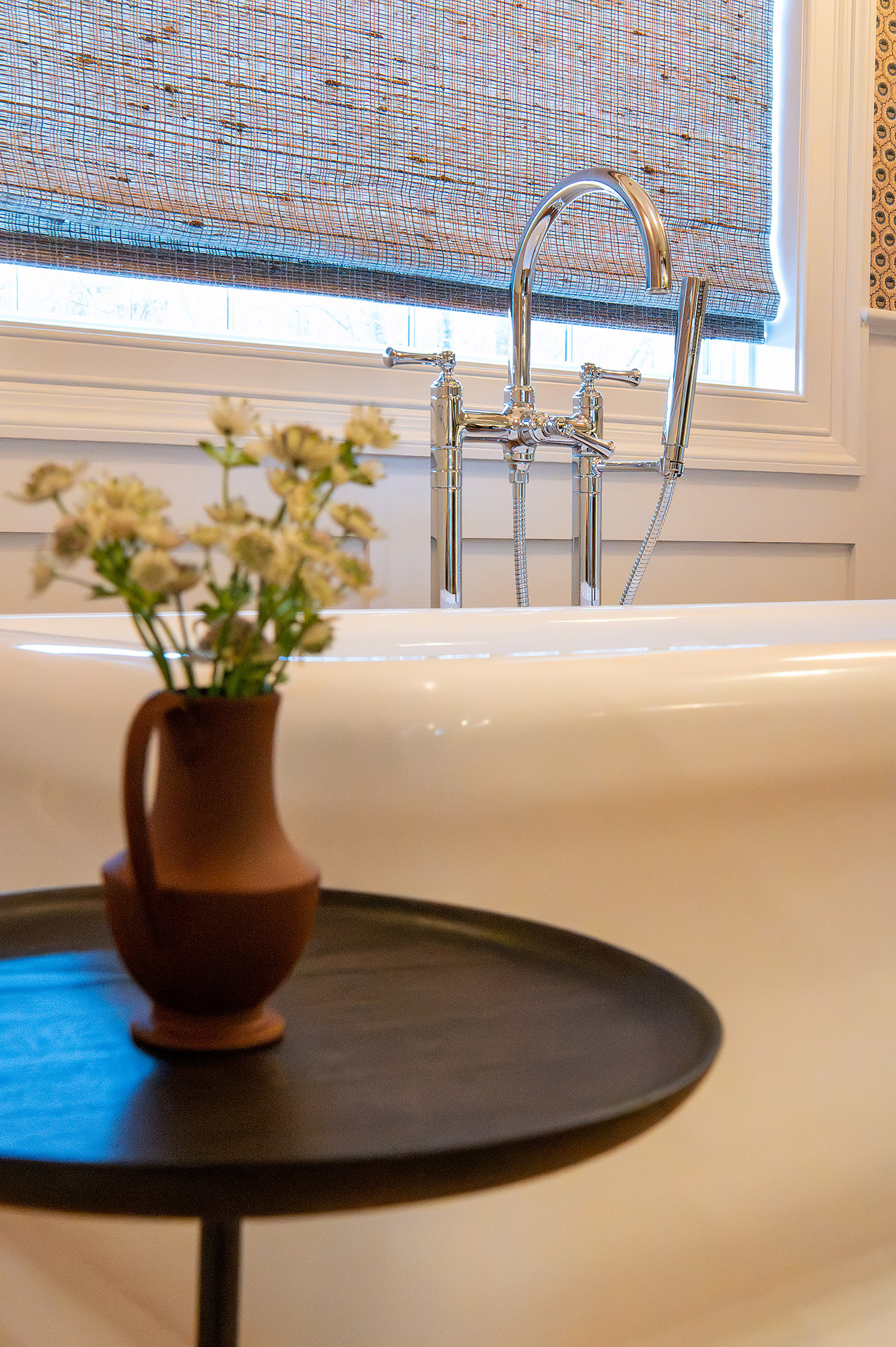 Primary bathroom bathtub detail chrome tub filler handheld woven shade terracotta pitcher daisies — Bronwyn Poole Interiors Primary bathroom bathtub detail chrome tub filler handheld woven shade terracotta pitcher daisies — Bronwyn Poole Interiors