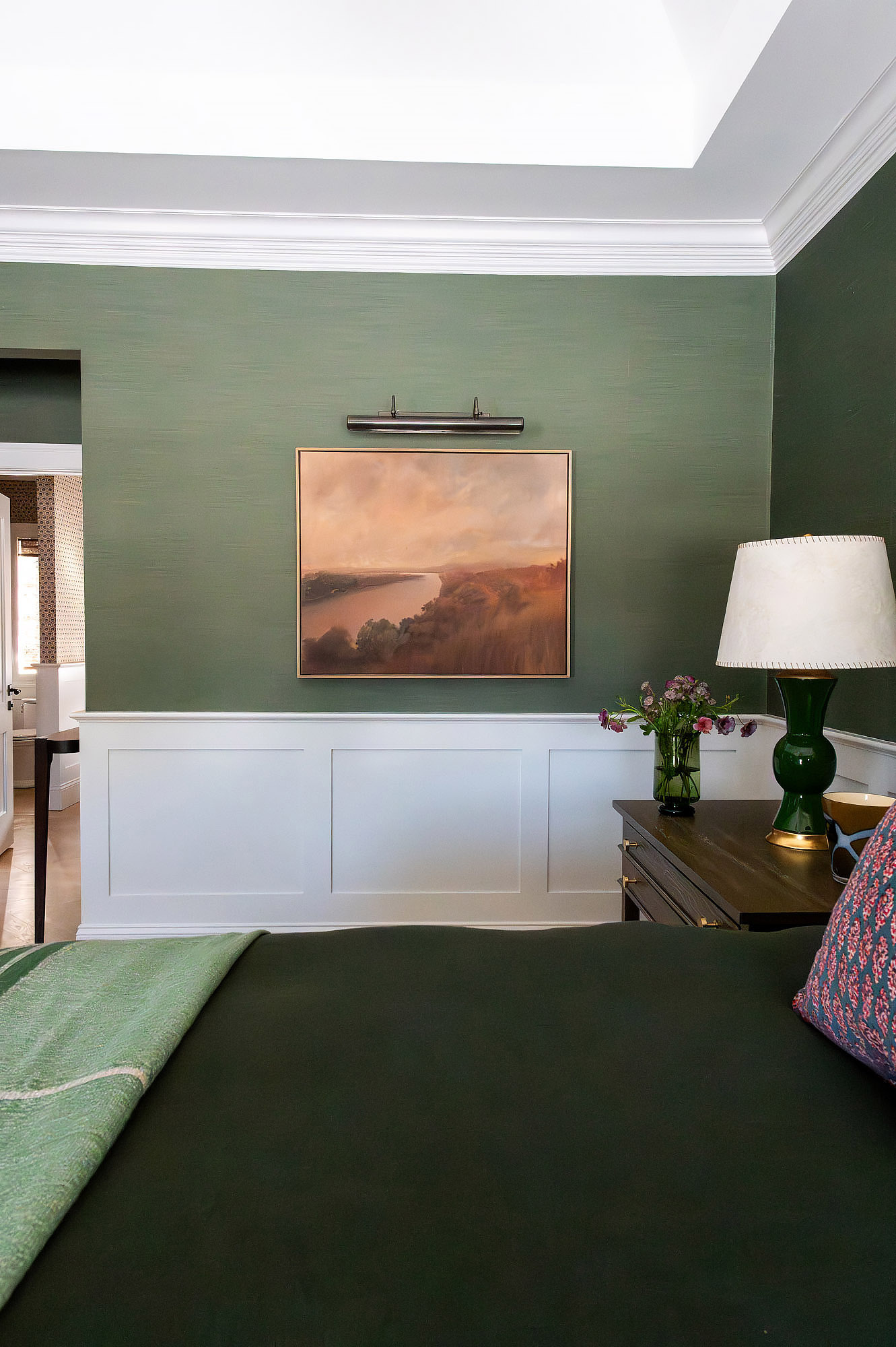 Primary bedroom tray ceiling green grasscloth river landscape painting picture light green glass lamp tulips — Bronwyn Poole Interiors