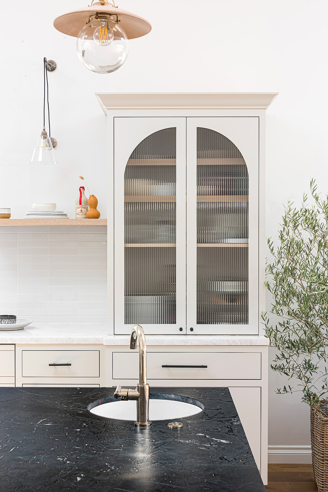 Kitchen arched glass cabinet soapstone counter brass globe pendant olive tree — Bronwyn Poole Interiors Kitchen arched glass cabinet soapstone counter brass globe pendant olive tree — Bronwyn Poole Interiors