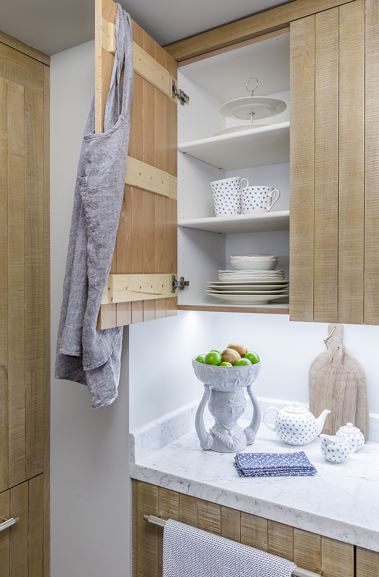 Kitchen cerused oak cabinet interior marble counter ceramic fruit bowl — Bronwyn Poole Interiors