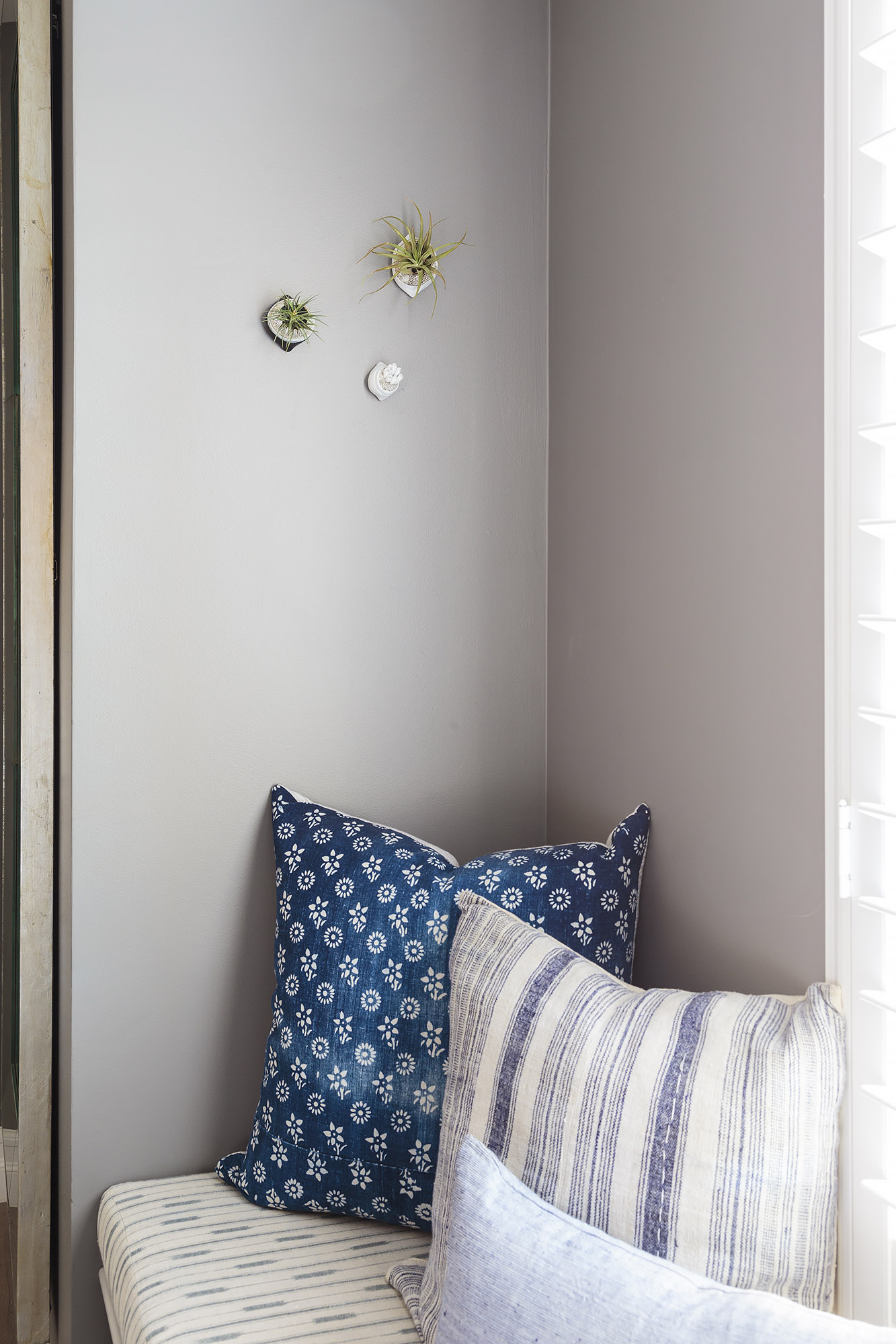 Primary bedroom window nook indigo floral cushion air plant detail — Bronwyn Poole Interiors Primary bedroom window nook indigo floral cushion air plant detail — Bronwyn Poole Interiors