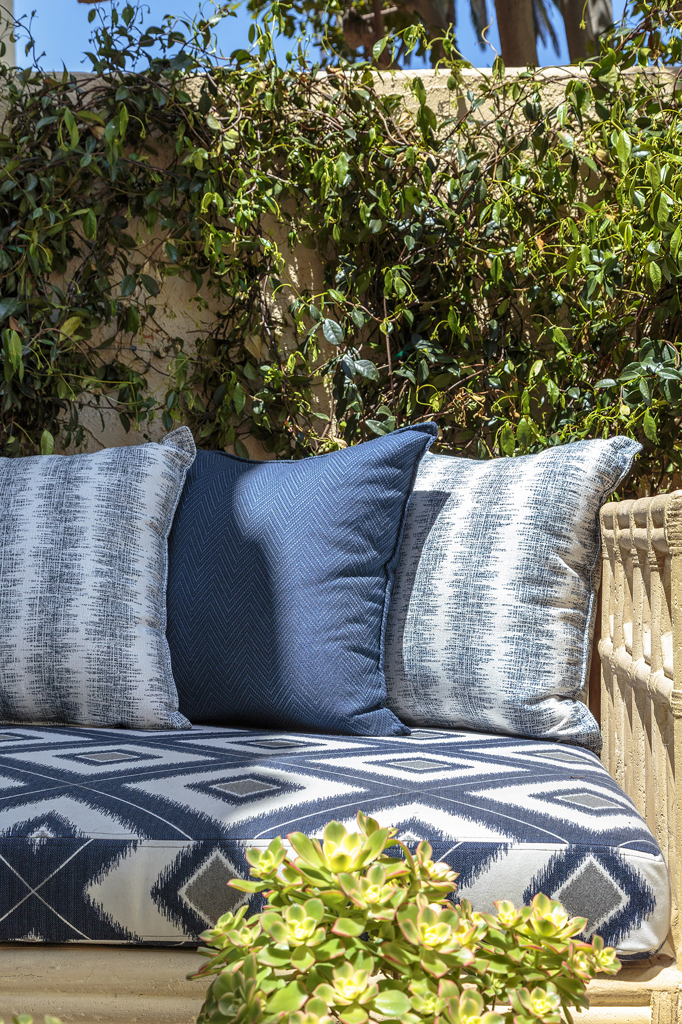 Susie courtyard blue ikat cushions outdoor sofa succulents detail — Bronwyn Poole Interiors Susie courtyard blue ikat cushions outdoor sofa succulents detail — Bronwyn Poole Interiors