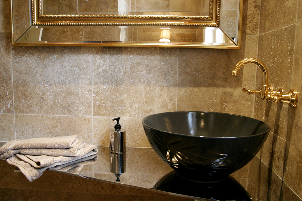 Bronwyn Poole Interiors Anthracite Vessel Basin Travertine Tile Gold Rope Mirror Brass Wall Faucet — Interior Design by Bronwyn Poole
