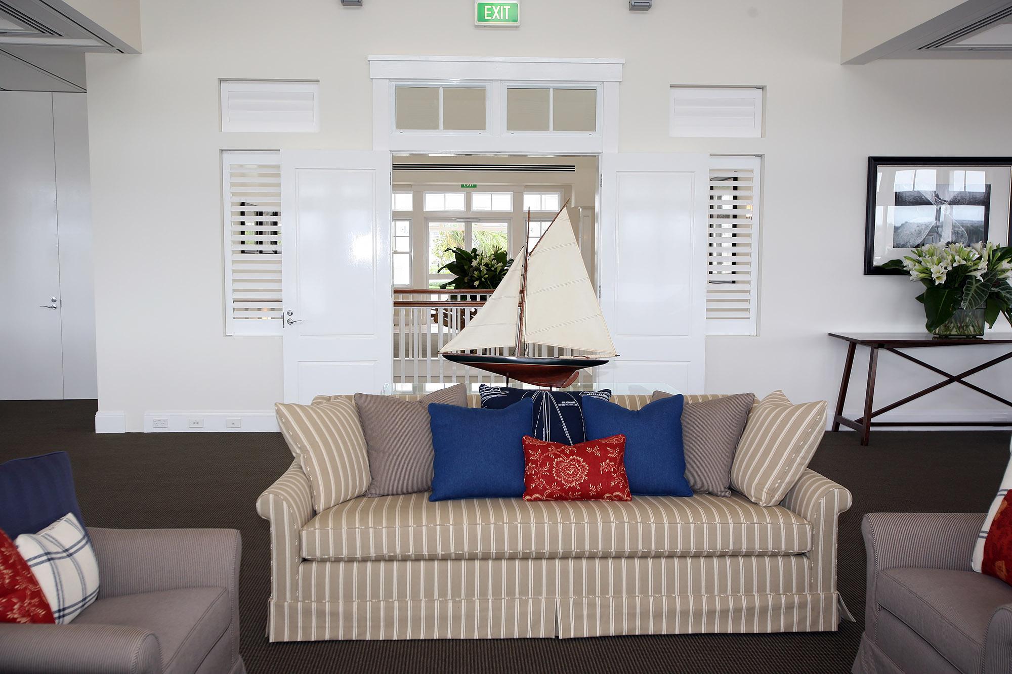 Bronwyn Poole Interiors Archive Nautical Clubhouse Striped Sofa Sailboat Model Plantation Shutters — Interior Design by Bronwyn Poole