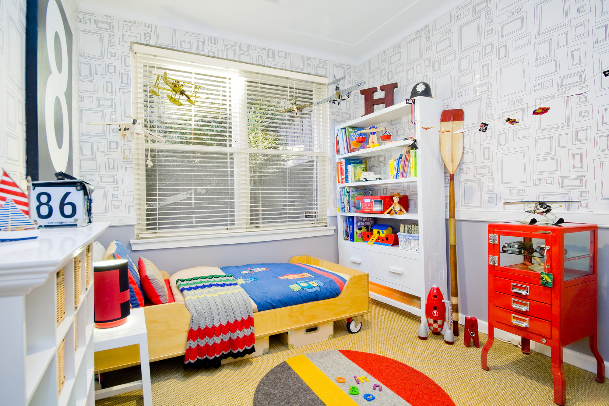 Bronwyn Poole Interiors Boys Bedroom Geometric Wallpaper Vintage Airplane Models Red Cabinet Nautical Decor — Interior Design by Bronwyn Poole
