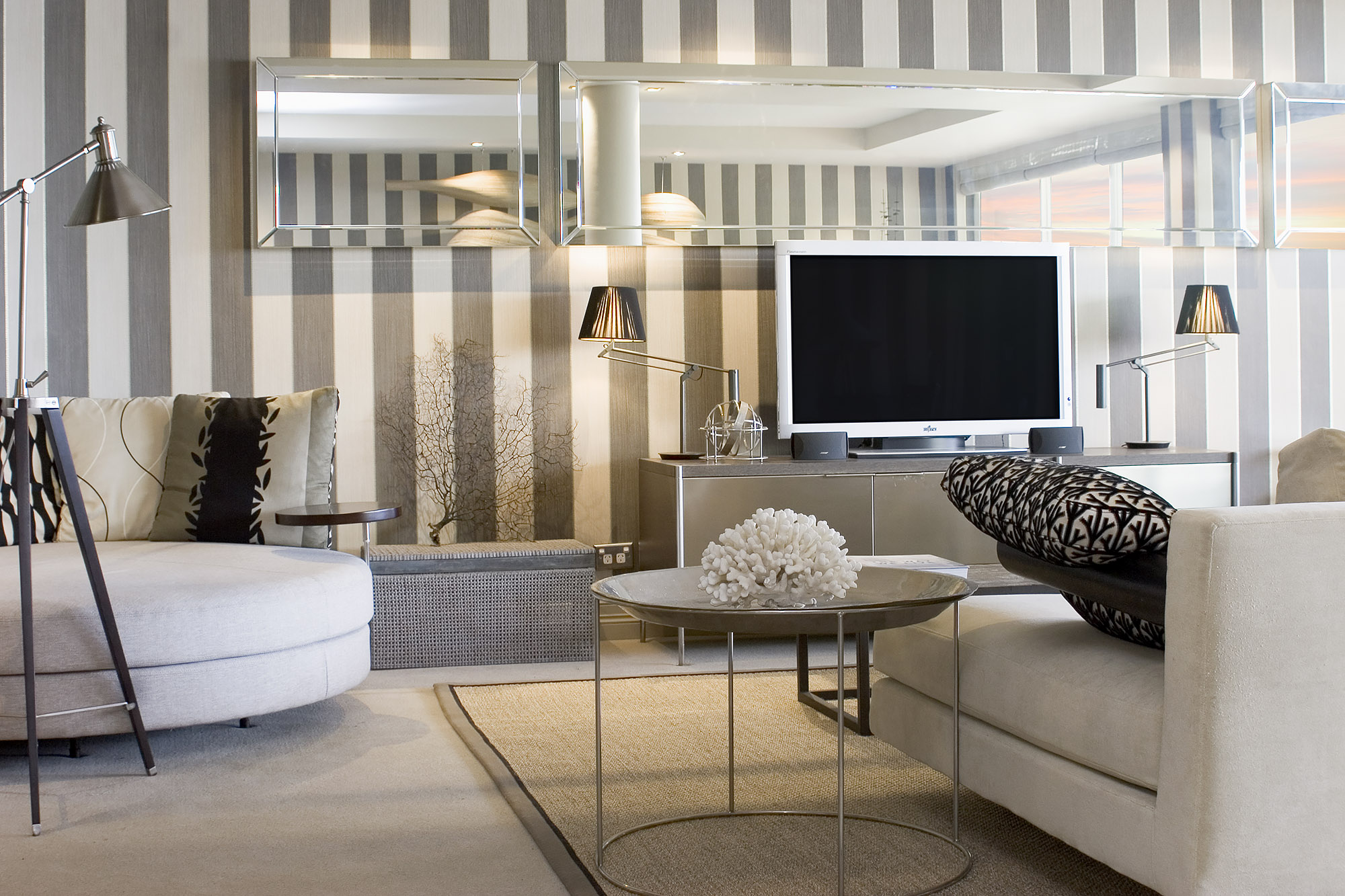 Bronwyn Poole Interiors Harbor Media Room Striped Wallpaper Curved Sofa Coral Decor Mirrored Console — Interior Design by Bronwyn Poole