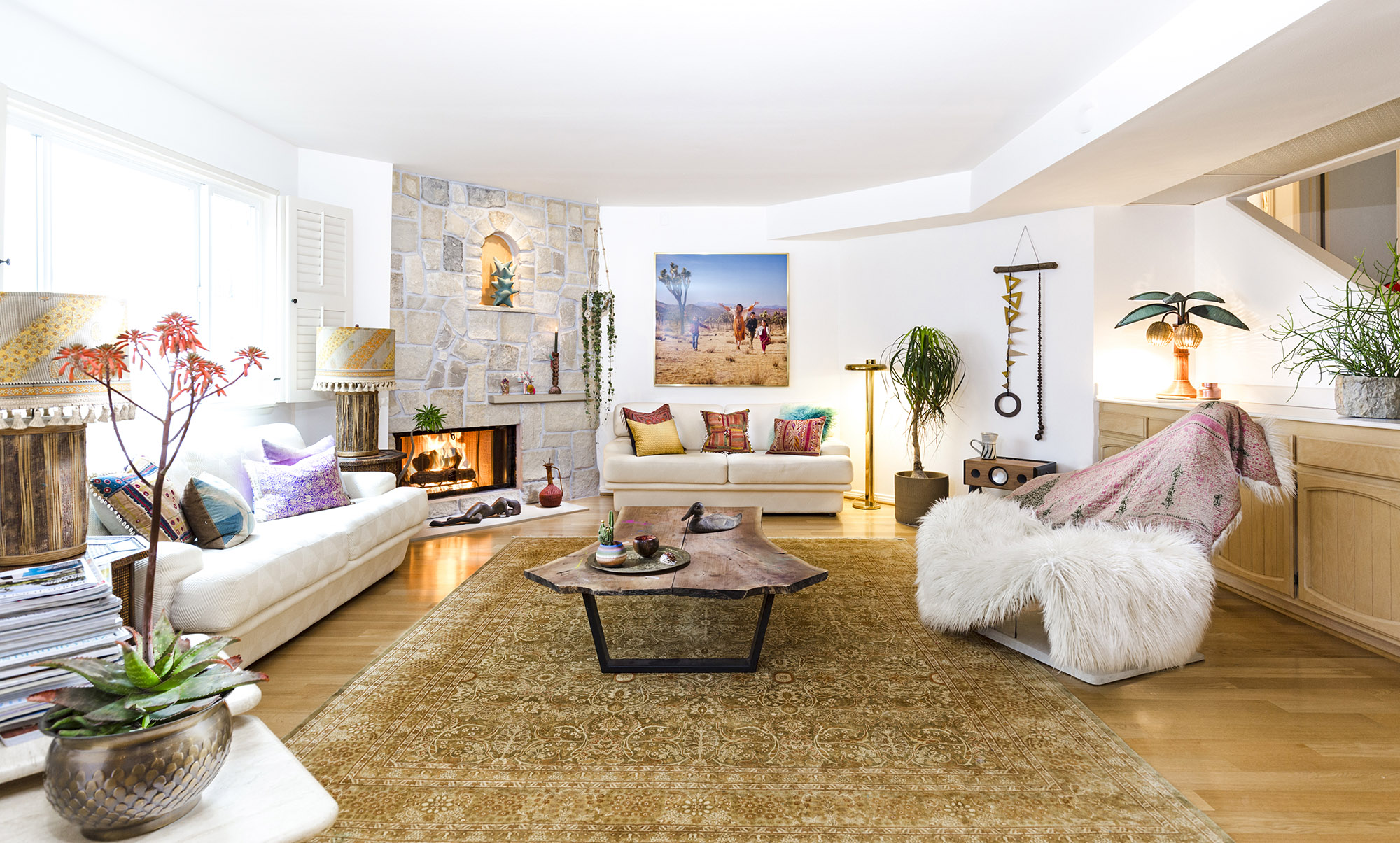 Bronwyn Poole Interiors Poole Residence Living Room Stone Fireplace Sheepskin Chair Desert Art Live Edge Table — Interior Design by Bronwyn Poole