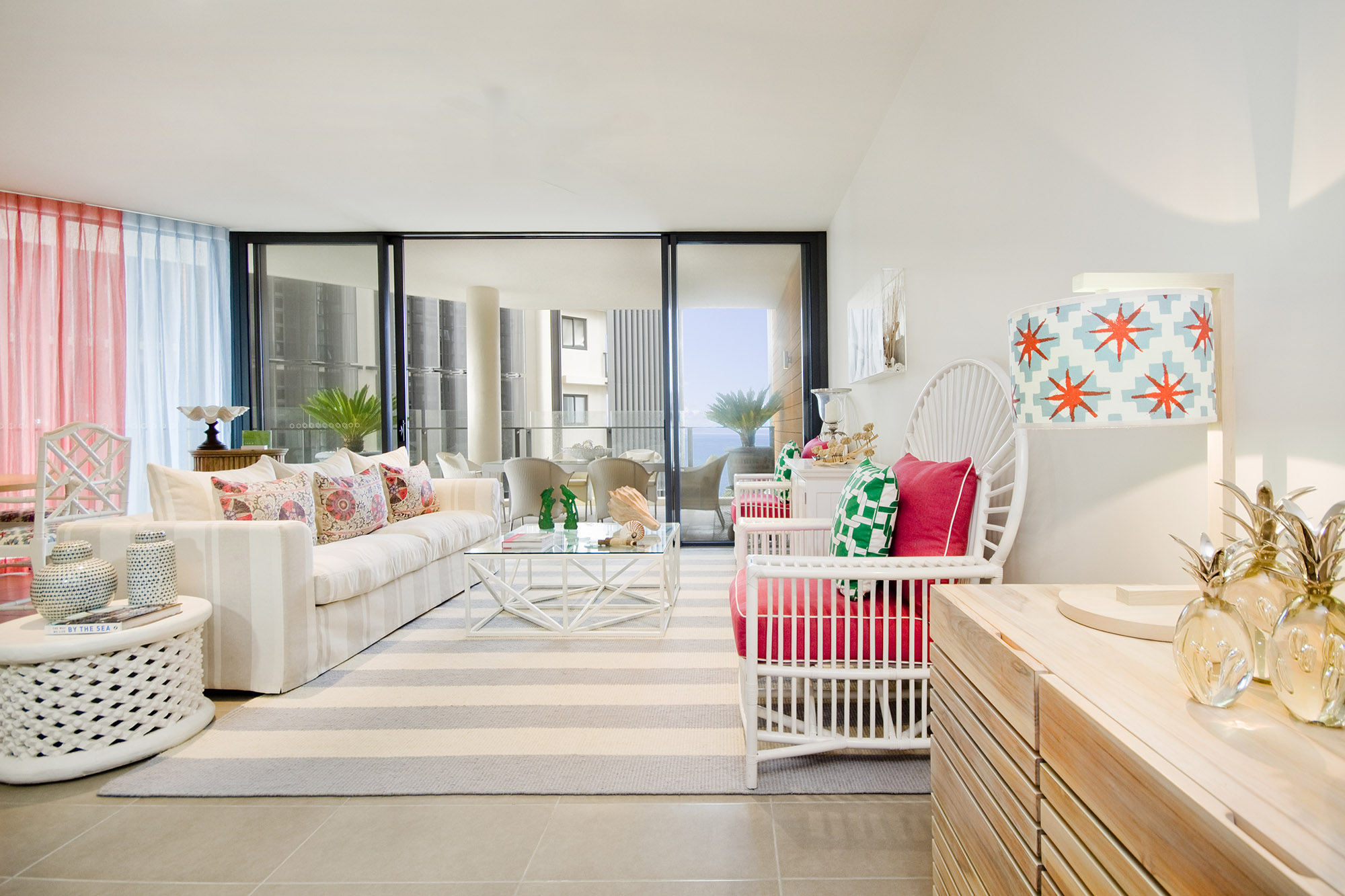 Bronwyn Poole Interiors Seaside Showhome Living Striped Sofa Pink Rattan Chairs Star Lampshade Ocean Balcony — Interior Design by Bronwyn Poole