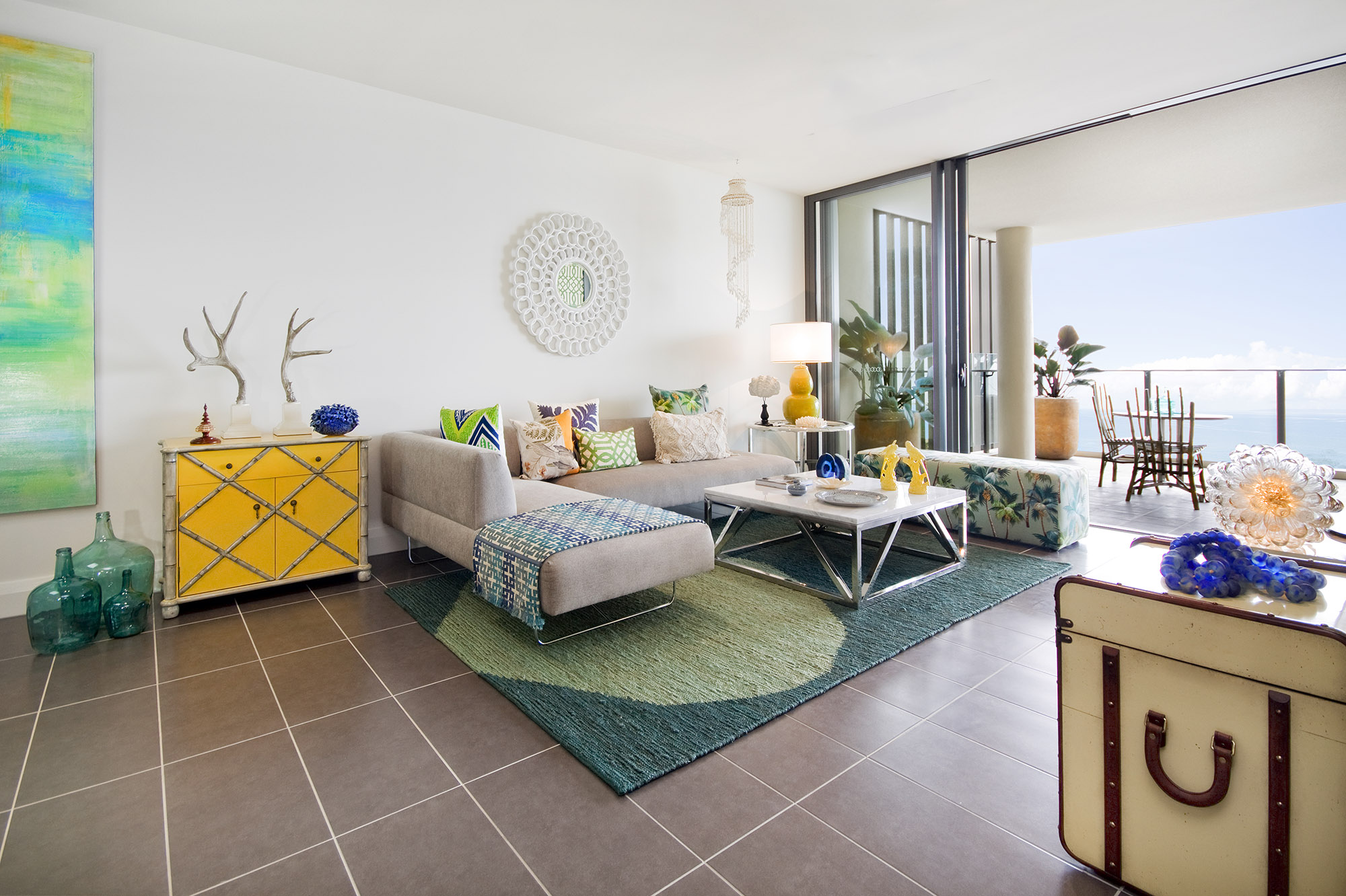 Bronwyn Poole Interiors Travelers Sanctuary Showhome Tropical Living Room Green Rug Sectional Sofa — Interior Design by Bronwyn Poole